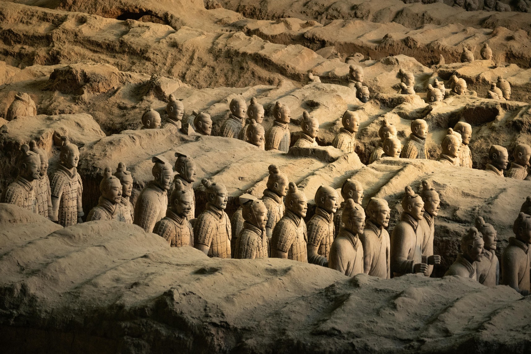 Terracotta Warriors standing in rows in an excavation pit in Xi’an