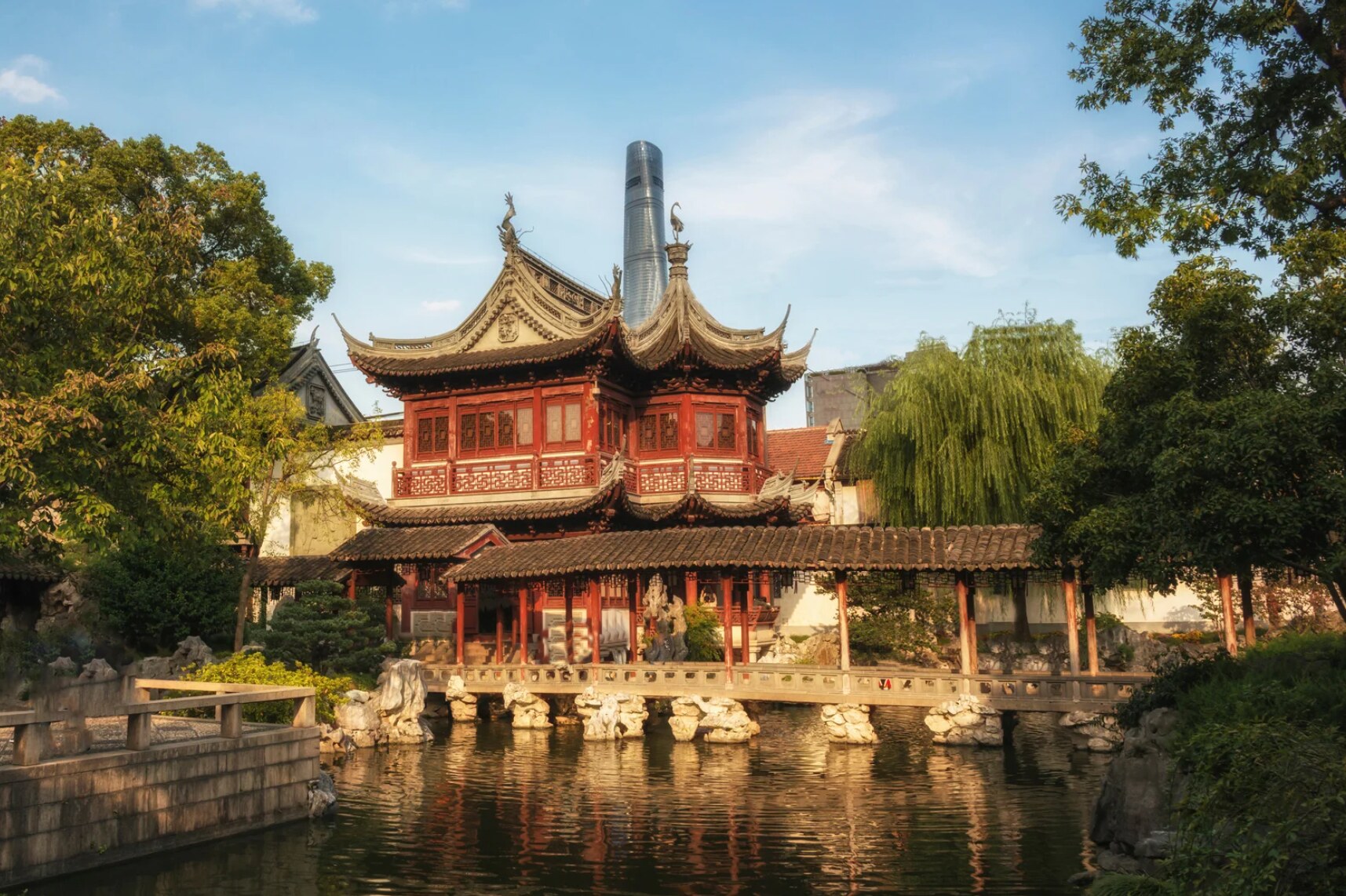 Traditional pavilions at Shanghai’s Yu Garden with Shanghai Tower rising in the background