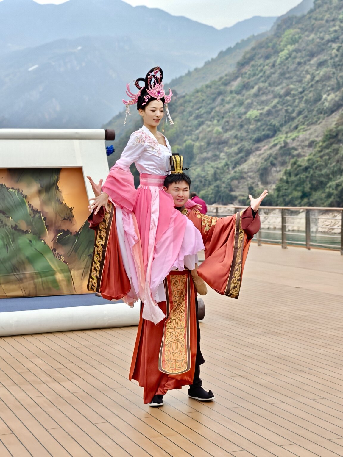 Performers in colorful traditional dress aboard a Yangtze River cruise ship
