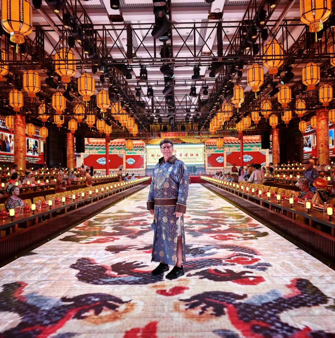 Steve wearing traditional Chinese clothing in an ornate palace setting