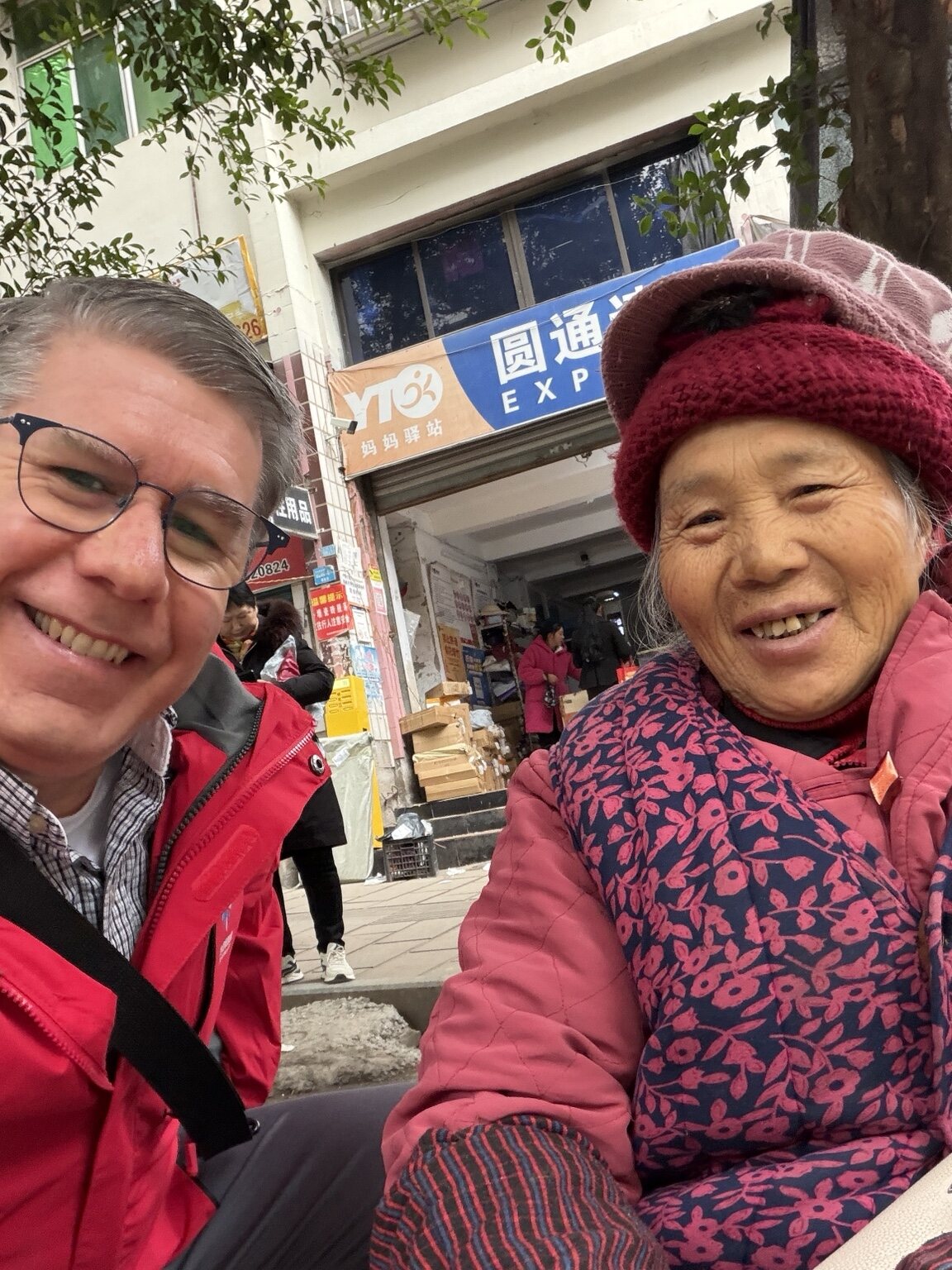 Steve sharing a smile with a woman in China
